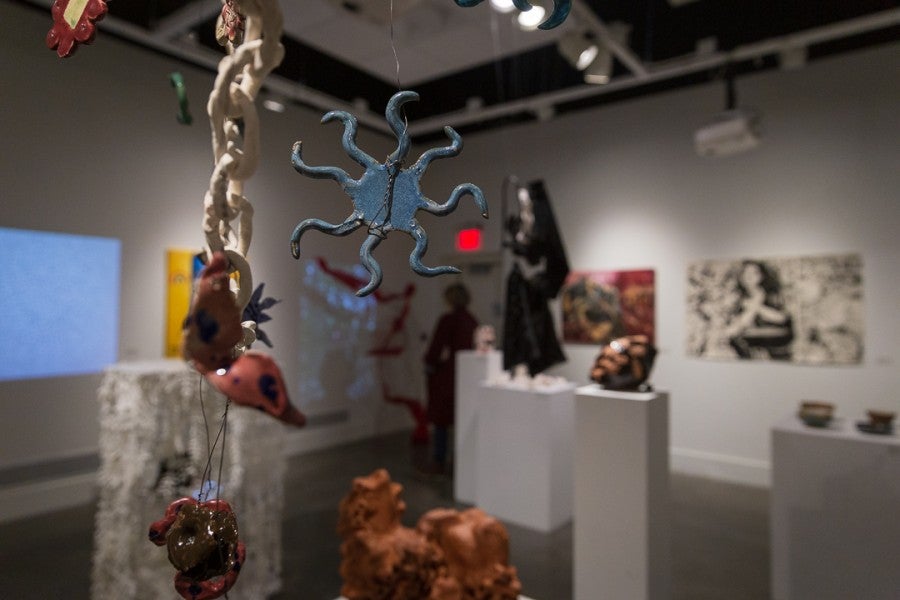 A selection of hanging ceramic art pieces