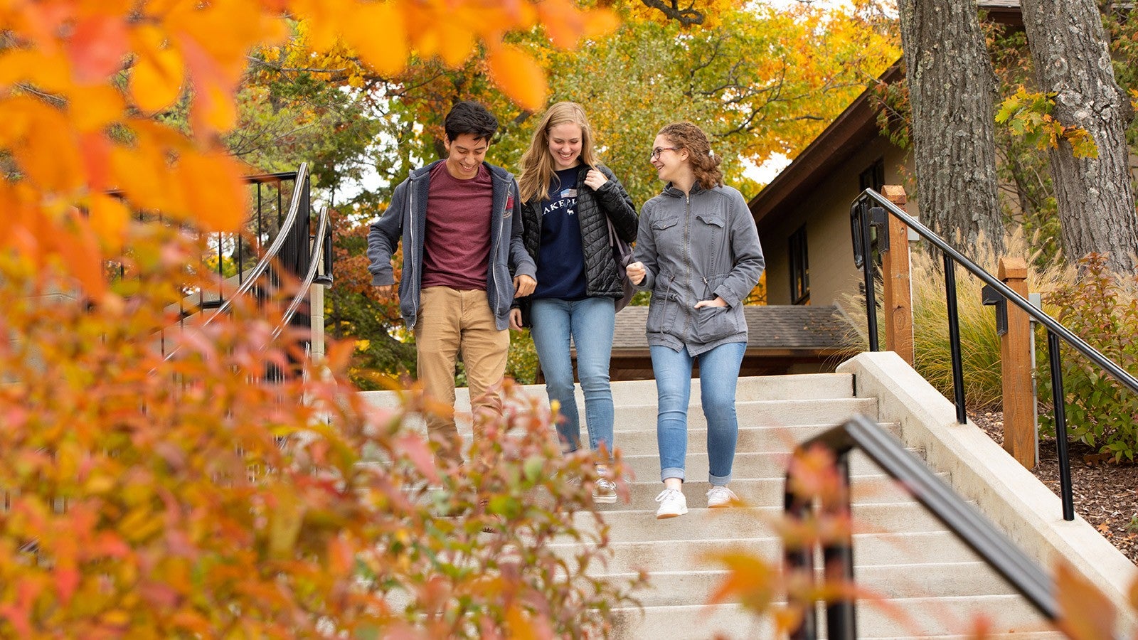Interlochen Arts Academy students laugh on their walk to launch