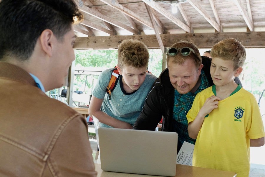 Dad checks in sons for Interlochen Arts Camp