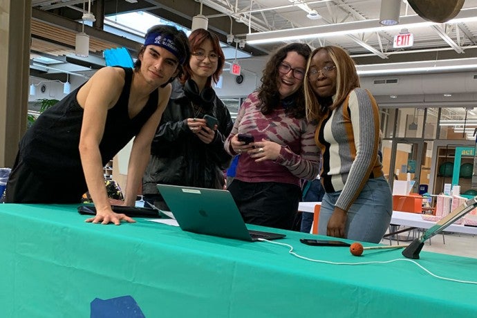 Student volunteers host the Act for Art kick-off party on May 3, 2023. 