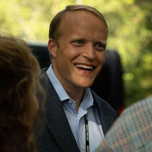 Trey Devey speaks with attendees at an event