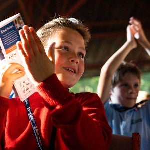 Junior students react to a performance at "Collage."