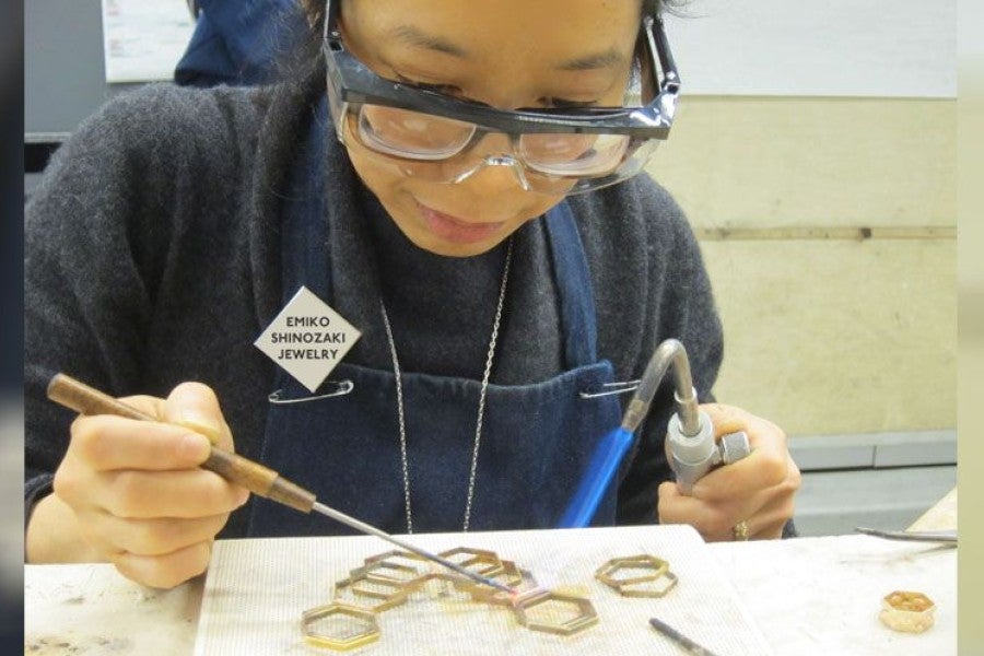 Shinozaki works on a piece.