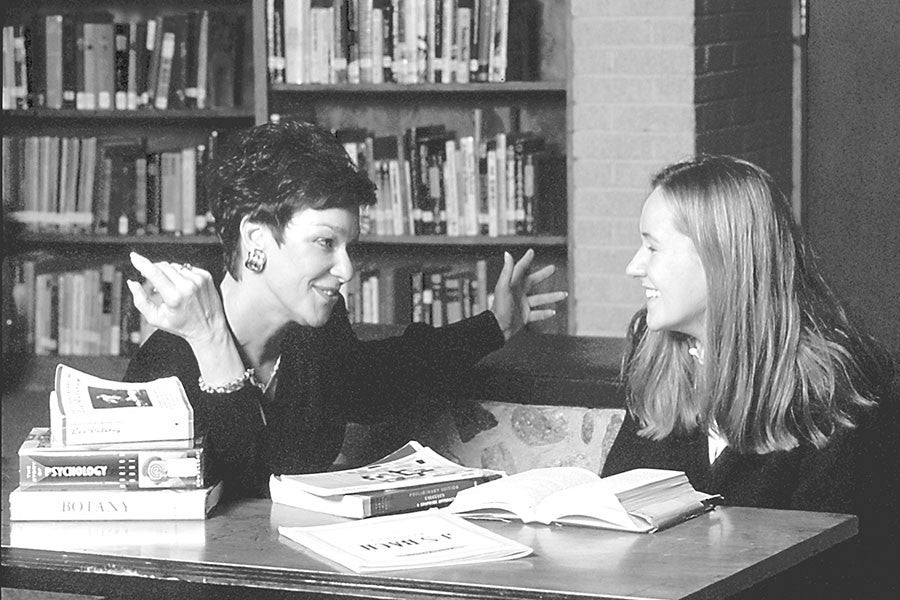 Jean Gaede works with a student in 1993.