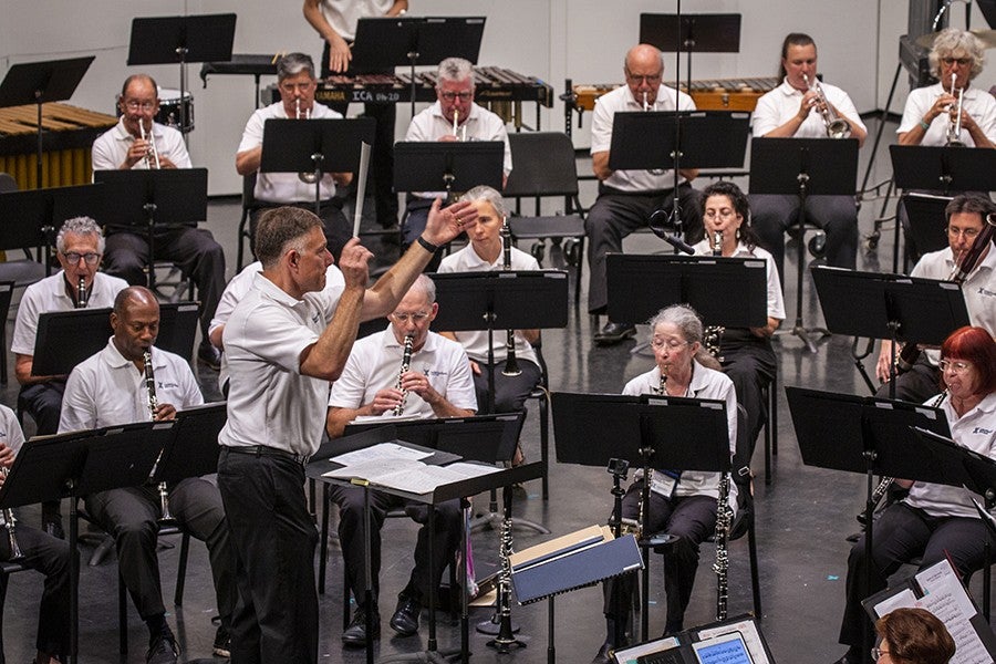 Photo of conductor leading Adult Band Camp concert