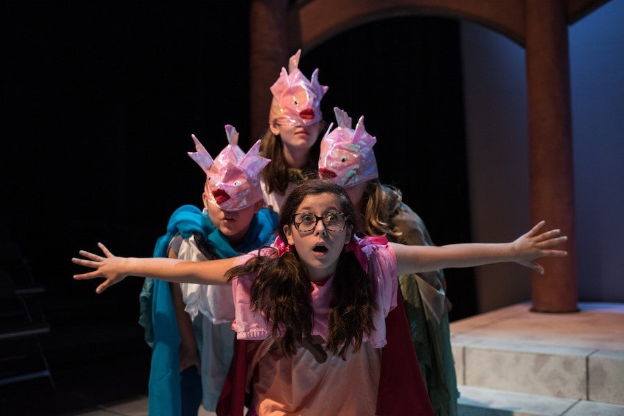 A group of students perform a play