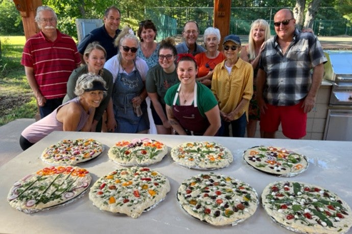 Participants in the summer 2022 focaccia class pose with their freshly made creations.