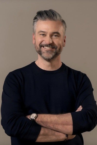 Professional headshot of Troy Quane