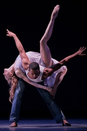 Craig Hall balances Wendy Whelan on his back.